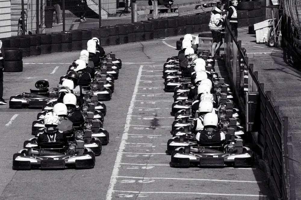 Virtual race cars lined up on the starting grid