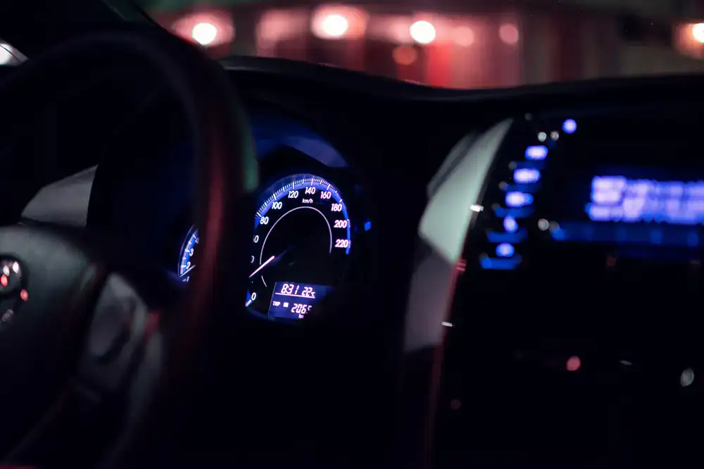Close up of a sim racing steering wheel and dashboard