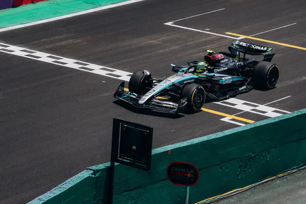 Sim racing car crossing the finish line in first place
